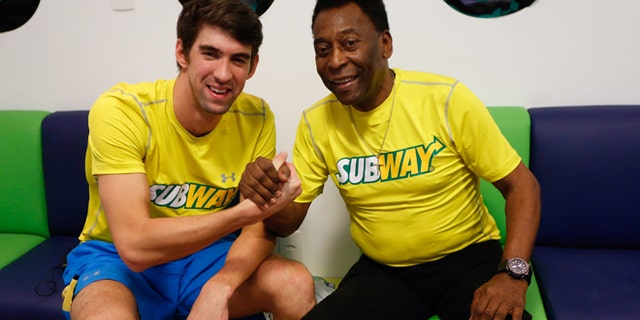 Michael Phelps and Pele at a press conference to promote healthy lifestyle among children on December 04, 2013 in Sao Paulo, Brazil.