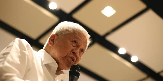 Philippine Foreign Secretary Albert del Rosario speaks during a news forum in suburban Pasig, east of Manila, Philippines Thursday, March 26, 2015. Rosario said China has been rushing construction projects, including massive land reclamations in the disputed South China Sea, before it gets potentially restricted by a proposed nonaggression pact and a case questioning the legality of Beijing's territorial claims. (AP Photo/Aaron Favila)