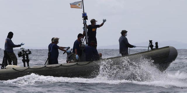 August 18, 2013: Philippine Navy and Coast Guard divers continue their search and rescue operation off Talisay coast, Cebu province following Friday night's collision of the passenger ferry MV Thomas Aquinas and the cargo ship MV Sulpicio Express Siete in central Philippines.