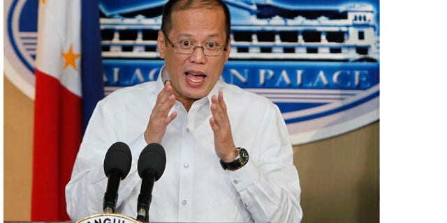 Sept. 20, 2010: Philippine President Benigno Aquino III gestures during a hastily-called news conference at the Presidential Palace in Manila, Philippines where he expresses hope that a government report that seeks to punish officials blamed for last month's bungled hostage rescue that killed eight Hong Kong tourists will pacify China and repair strained ties.