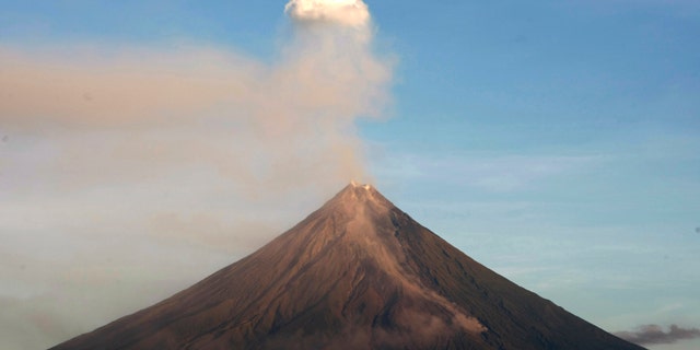 Mayon volcano spews ash anew in another "ash explosion" as viewed in Legazpi city, Albay province, about 500 kilometers south of Manila. Security forces will forcibly evacuate thousands of residents reluctant to leave their farms around the slopes of the country's most active volcano despite fears of a major eruption.
