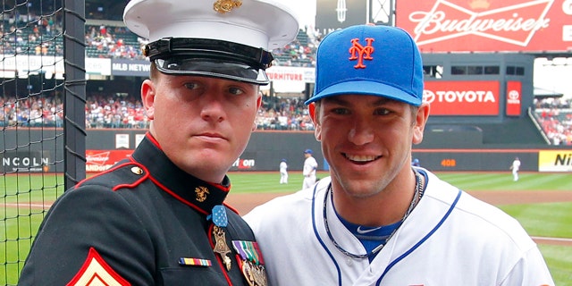 Sept. 24: Medal of Honor recipient Dakota Meyer of the U.S. Marine Corps is presented with an American flag by New York Mets' Josh Thole.