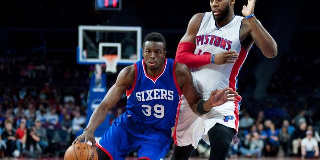 Dec 6, 2014; Auburn Hills, MI, USA; Philadelphia 76ers forward Jerami Grant (39) drives past Detroit Pistons forward Greg Monroe (10) during the first quarter at The Palace of Auburn Hills. Mandatory Credit: Tim Fuller-USA TODAY Sports