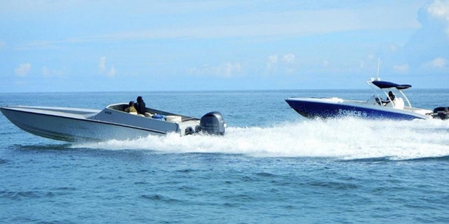 Sept. 18 2014: A maritime patrol aircraft detected this 40-foot go-fast vessel in the Caribbean Sea. DEA and Bahamian Police officials responded to the location and detained two suspects after locating 40 bales of marijuana. (U.S. Coast Guard photo)