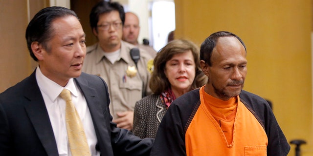 Francisco Sanchez, right, is lead into the courtroom by San Francisco Public Defender Jeff Adachi, left, and Assistant District Attorney Diana Garciaor, center, for his arraignment at the Hall of Justice on Tuesday, July 7, 2015  in San Francisco. Prosecutors have charged the Mexican immigrant with murder in the waterfront shooting death of 32-year-old Kathryn Steinle. (Michael Macor/San Francisco Chronicle via AP, Pool)