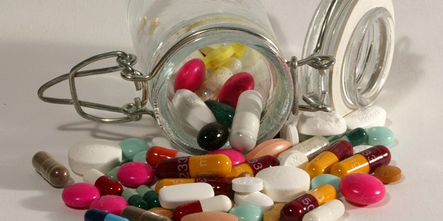File photo illustration of pills of all kinds, shapes and colours, March 2003. HALTH NO RIGHTS CLEARANCES OR PERMISSIONS ARE REQUIRED FOR THIS IMAGE REUTERS/Jacky Naegelen JNA/MA