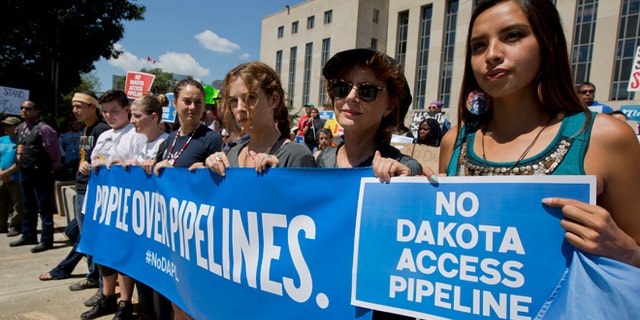 Actresses Shailene Woodley and Susan Sarandon participate in a rally outside the US District Court in Washington, Wednesday, Aug. 24, 2016, in solidarity with the Standing Rock Sioux Tribe.