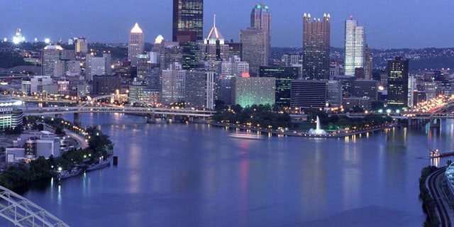 View of the downtown Pittsburgh skyline at dusk, showing the Allegheny and Monongahela rivers joining to form the Ohio River. Three Rivers Stadium is on the left. October 7, 1999. (Photo by Steven Adams/Getty Images)