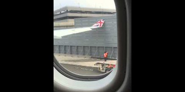 The wing of a London-bound flight made contact with a gate at New York's John F. Kennedy International Airport in this photo.