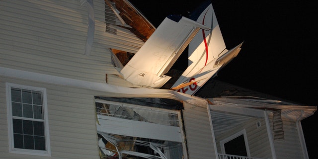 May 31, 2013: This handout photo provided by the Virginia State Police shows a small plane crashed into the living room of an apartment in Herndon, Va. Capt. Willie Bailey with Fairfax County Fire and Rescue in Virginia says the plane ran out of fuel early Friday and crashed, injuring two people one in the apartment and one in the Cessna 177B.