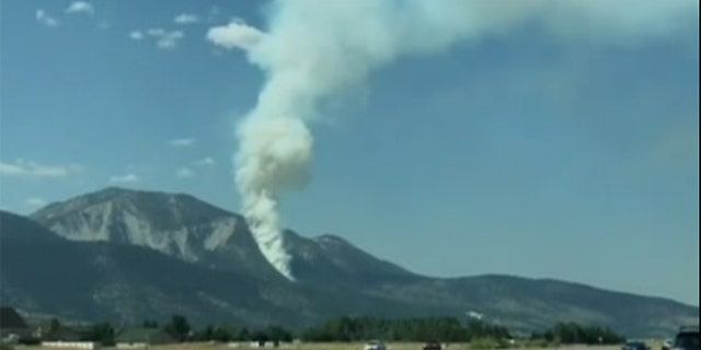 A small aircraft crashed Sunday on a rugged and scenic mountain south of Reno, igniting a wildfire in Nevada. (Kris Swaczyna via Storyful)