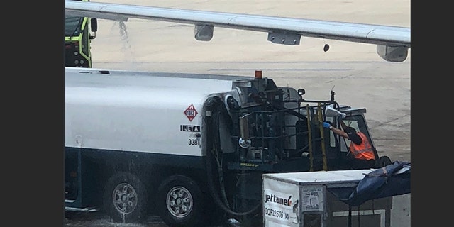 An American Airlines flight was delayed after fuel was seen leaking from the plane wing.