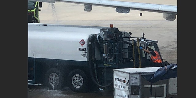 An American Airlines flight was delayed after fuel was seen leaking from the plane wing.