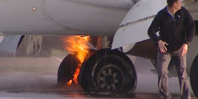 May 18, 2013: Passengers leave a Boeing 737 belonging to Russian carrier UTair in Vnukovo airport, Russia. Emergency officials said the landing gear of a plane carrying more then 130 people caught on fire as it was landing. All passengers and crew members were safely evacuated.