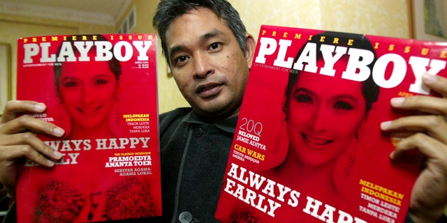 April 6, 2006: Playboy Indonesia editor-in-chief Erwin Arnada shows copies of the first edition of the magazine in Jakarta, Indonesia.