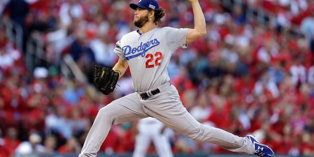 FILE - In this Oct. 7, 2014, file photo, Los Angeles Dodgers starting pitcher Clayton Kershaw throws a pitch during the second inning of Game 4 of baseball's NL Division Series against the St. Louis Cardinals in St. Louis. Kershaw has been voted the player of the year in balloting by his fellow major leaguers. The players' union said Monday, Nov. 3, that Kershaw also won the Marvin Miller Man of the Year award. (AP Photo/Jeff Roberson, File)