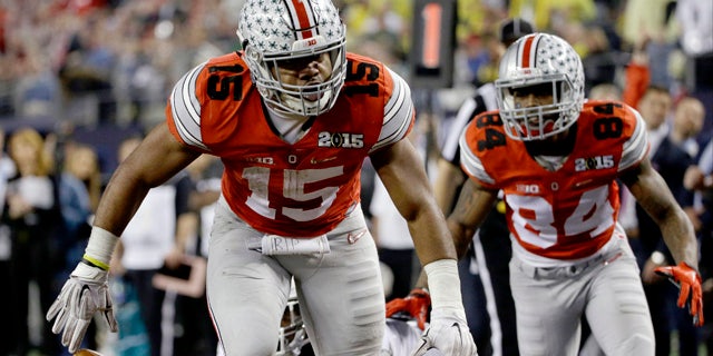 Jan. 12, 2015: Ohio State's Ezekiel Elliott (15) celebrates after a nine-yard touchdown run during the second half of the NCAA college football playoff championship game against Oregon in Arlington, Texas. (AP Photo/David J. Phillip)