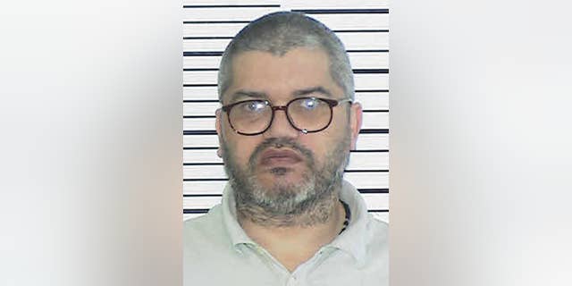 This undated photo provided by the Bronx County District Attorney's office in New York shows Leonardo Espinal. The 49-year-old Bronx man has been sentenced to 20 years to life in prison for lacing his children's pizza with rat poison after he discovered that his ex-wife was seeing another man. Prosecutors say Leonardo Espinal was sentenced on Thursday after pleading guilty last month to the 2012 murder of his 5-year-old son and the attempted murder of his 7-year-old daughter. (AP Photo/Bronx County District Attorney's office)