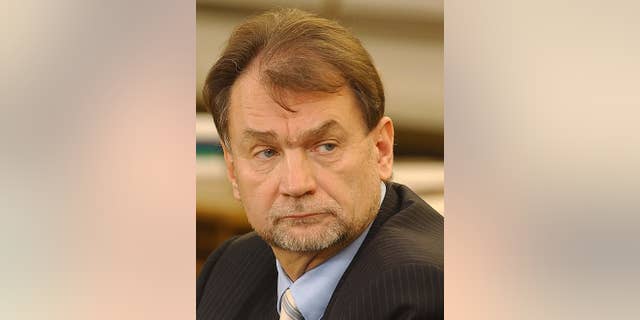 FILE - In this Nov. 30, 2004 file photo Jan Kulczyk appears at a special parliamentary commission that examined the deals of the fuel giant PKN Orlen. Kulczyk Holding says Wednesday July 29, 2015, that its founder and president, Jan Kulczyk, Poland's richest businessman, has died from complications after surgery. He was 65. For years, Kulczyk, a lawyer and manager by education, led lists of the richest Poles and was reputed for his courage and imagination in business decisions. He invested in the energy and natural resources sectors in Europe and in Africa, and developed the car sector in Poland. (AP Photo/Czarek Sokolowski)