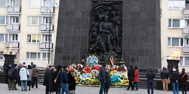 April 19, 2015: People gather in front of the monument to the Heroes of the Ghetto, on the 72nd anniversary of the Warsaw Ghetto Uprising, in Warsaw. (AP Photo/Czarek Sokolowski)