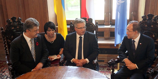 May 7, 2015: Poland's President Bronislaw Komorowski, center, meets U.N. Secretary General Ban Ki-moon, right, and Ukraines President, Petro Poroshenko, left, at the City Hall in Gdansk, Poland, shortly before ceremonies he organized to mark 70 years of the end of World War II that began with Nazi Germanys attack on Poland in 1939.