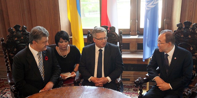 May 7, 2015: Poland's President Bronislaw Komorowski, center, meets U.N. Secretary General Ban Ki-moon, right, and Ukraines President, Petro Poroshenko, left, at the City Hall in Gdansk, Poland, shortly before ceremonies he organized to mark 70 years of the end of World War II that began with Nazi Germanys attack on Poland in 1939.