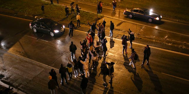 Nov. 16, 2015: Marchers stop traffic on an entrance ramp to westbound Interstate 94 in Minneapolis before moving to the main freeway. The mayor of Minneapolis on Monday asked for a federal civil rights investigation into the weekend shooting of a black man by a police officer during an apparent struggle.(Jeff Wheeler/Star Tribune via AP)