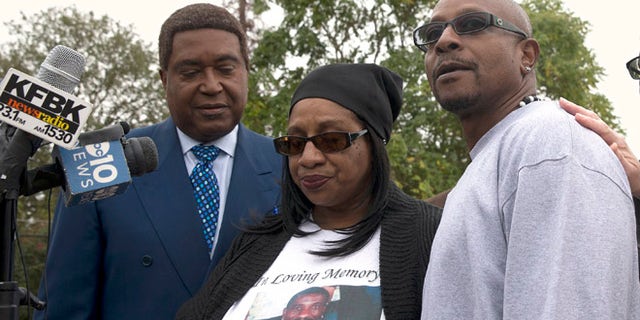 Robert Mann, right, the brother of Joseph Mann, who was killed by Sacramento Police in July, discusses the shooting of his brother during a news conference Monday, Oct. 3, 2016, in Sacramento, Calif. Mann, accompanied by his sister, Deborah, center, and attorney John Burris are demanding that the officers involved in shooting of Joseph Mann, 50, be charged with murder and that the U.S. Department of Justice open a civil rights investigation of the Sacramento Police Department. (AP Photo/Rich Pedroncelli)