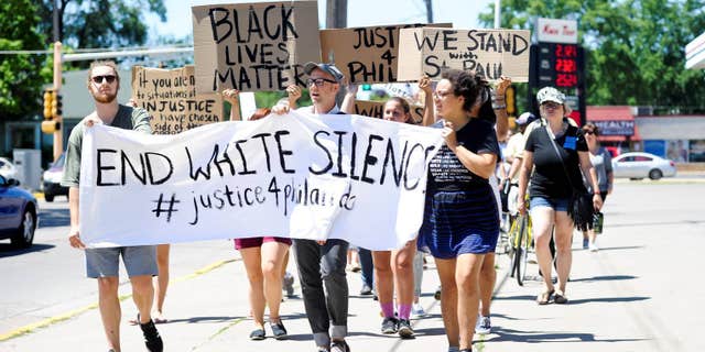 A peaceful gathering and march, Saturday, July 9, 2016, in Winona, Minn.