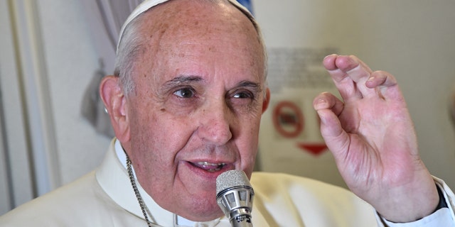 Jan. 19, 2015: Pope Francis gestures as he talks with journalists during his flight from Manila to Rome. (AP Photo/Giuseppe Cacace, pool)