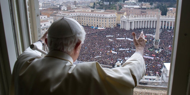 Pope Benedict XVI delivers his blessing during his last Angelus Prayer from the window of his studio overlooking St. Peter's Square at the Vatican, Feb. 24, 2013.