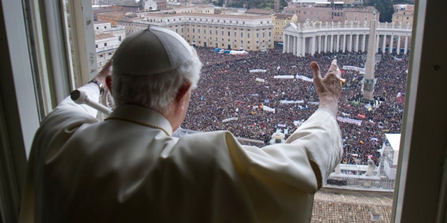 Pope Benedict XVI delivers his blessing during his last Angelus Prayer from the window of his studio overlooking St. Peter's Square at the Vatican, Feb. 24, 2013.
