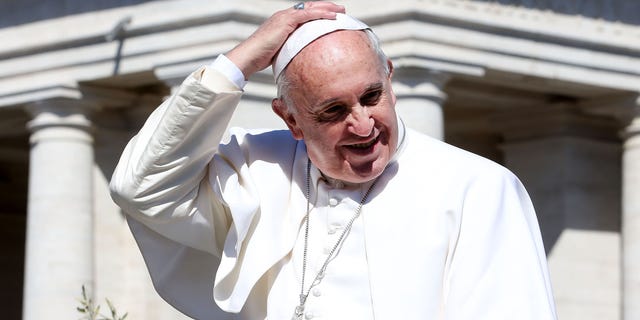 VATICAN CITY, VATICAN - MARCH 29: Pope Francis waves to the faithful as he leaves St. Peter's Square at the the end of Palm Sunday Mass on March 29, 2015 in Vatican City, Vatican. On Palm Sunday Christians celebrate Jesus' arrival into Jerusalem, where he was put to death. It marks the official beginning of Holy Week during which Christians observe the death of Christ before celebrations begin on Easter. (Photo by Franco Origlia/Getty Images)