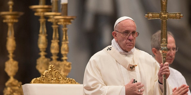Pope Francis holds the pastoral staff as he celebrates a Mass for families in St.Peter's Basilica at the Vatican, Sunday, Dec. 27, 2015. (AP Photo/Alessandra Tarantino)