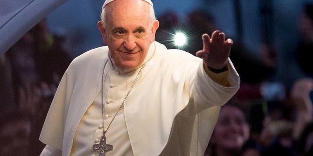 RIO DE JANEIRO, BRAZIL - JULY 26: Pope Francis waves from the Popemobile on his way to attend the Via Crucis on Copacabana Beach during World Youth Day celebrations on July 26, 2013 in Rio de Janeiro, Brazil. More than 1.5 million pilgrims are expected to join the pontiff for his visit to the Catholic Church's World Youth Day celebrations which is running July 23-28. (Photo by Buda Mendes/Getty Images)