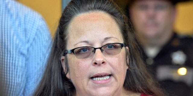 Rowan County Clerk Kim Davis makes a statement to the media at the front door of the Rowan County Judicial Center in Morehead, Kentucky. (AP Photo/Timothy D. Easley, File)