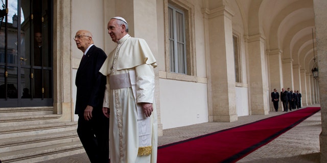 Pope Francis  is welcomed by Italian president Giorgio Napolitano as he arrives for an official visit at Quirinale Presidential palace in Rome, Thursday, Nov. 14, 2013. (AP Photo/Alessandra Tarantino)