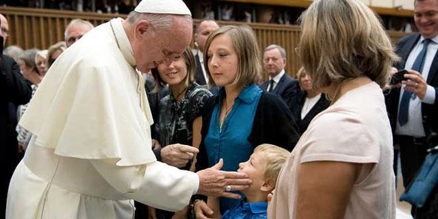 Pope Francis meets relatives of the victims of the Nice truck attack this summer, during a special audience in the Pope Paul IV hall, at the Vatican, Saturday, Sept. 24, 2016. Pope Francis has received relatives of the victims of the Nice truck attack this summer, saying he offered ââ¬Åimmense compassionââ¬Â and encouraging them not to respond to hatred with hatred. (L'Osservatore Romano/Pool Photo via AP)
