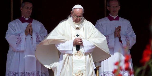 Pope Francis arrives to celebrate a canonization ceremony of four new saints in St. Peter's Square at the Vatican, Sunday, May 17, 2015. Among them are Arab nuns Sts. Mariam Bawardy and Marie Alphonsine Ghattas, who lived in what was Ottoman-ruled Palestine in the 19th century. (AP Photo/Alessandra Tarantino)