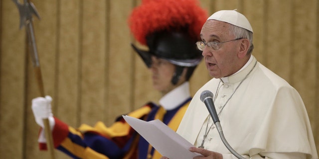 Pope Francis delivers his speech during an audience with relatives of police officers who died in the line of duty, in the Pope Paul VI hall, at the Vatican, Thursday, May 21, 2015. (AP Photo/Andrew Medichini)