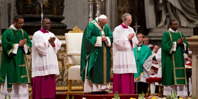 Pope Francis celebrates a Mass for newly-elected cardinals, in St. Peter's Basilica at the Vatican, Sunday, Feb. 15, 2015. Pope Francis welcomed 20 new cardinals Saturday into the elite club of churchmen who will elect his successor and immediately delivered a tough-love message to them, telling them to put aside their pride, jealousy and self-interests and instead exercise perfect charity. (AP Photo/Andrew Medichini)