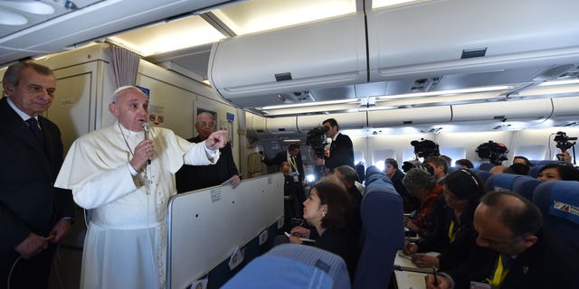 Jan. 19, 2015 - Pope Francis talks with journalists during his flight from Manila to Rome. Although the trips are unconfirmed, Francis is expected to visit Philadelphia, the White House, and the UN in New York in September.