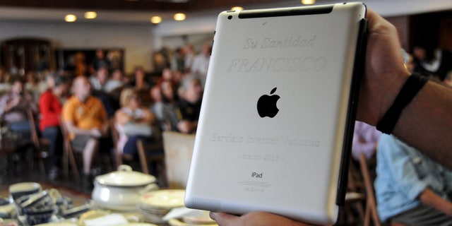An Apple iPad which belonged to Pope Francis is seen at Castells auction house in Montevideo, April 14, 2015.