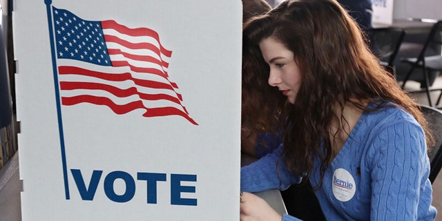 Abi Nesbitt, a UW-Eau Claire freshman from Mosinee, Wis., votes in her first primary election at UW-Eau Claire's Davies Center.