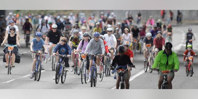 FILE - In this Aug. 8, 2010 file photo, thousands of bicyclists ride on the Providence Bridge Pedal in Portland, Ore. Portland is known as one of America's most bike-friendly cities, but cyclists have become so alarmed by a growing number of bike thefts that Portland police are creating a task force to catch more of the culprits. (AP Photo/Rick Bowmer, File)