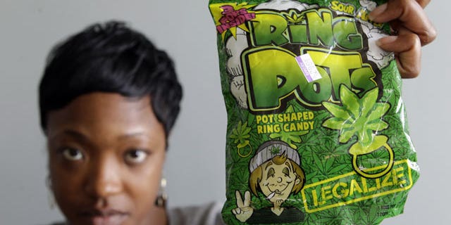 Oct. 6: Felicia Williams, Community Liason for Buffalo City Council member Darius Pridgen, holds a package of "Ring Pots" candy in Buffalo, N.Y.