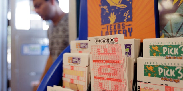 ADDS NUMBER OF WINNERS AND ACTUAL DRAWING AMOUNT - Powerball lottery forms are seen, Wednesday, Aug. 7, 2013, in San Antonio. The Powerball jackpot is expected to be about $425 million by Wednesday's drawing, making it the game's third largest ever. Sue Dooley, senior drawing manager production coordinator for the Multi-State Lottery Association, said late Wednesday night that three tickets matched all six numbers and would split the $448 million Powerball jackpot. (AP Photo/Eric Gay)
