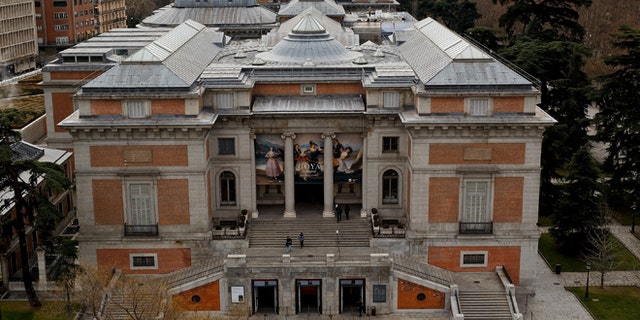 People walk around The Prado Museum in Madrid, Spain. (Photo by Pablo Blazquez Dominguez/Getty Images)