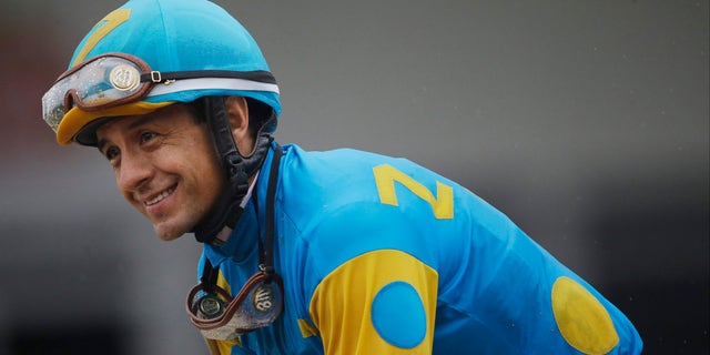 Jockey Victor Espinoza celebrates aboard American Pharoah after winning the 140th Preakness Stakes horse race at Pimlico Race Course, Saturday, May 16, 2015, in Baltimore. (AP Photo/Patrick Semansky)