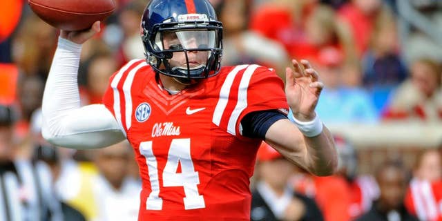 Mississippi quarterback Bo Wallace (14) releases a pass during the first half of an NCAA college football game against Presbyterian in Oxford, Miss., Saturday, Nov. 8, 2014. (AP Photo/Thomas Graning)